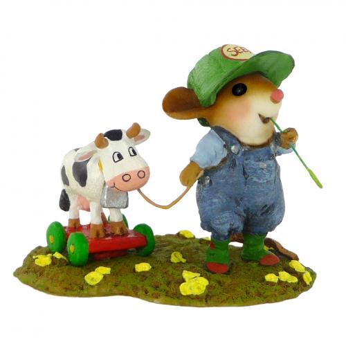 Mouse Playing with Toy Cow